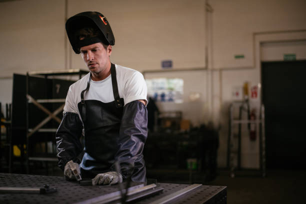 istock Handsome welder working in his wokshop 959243732