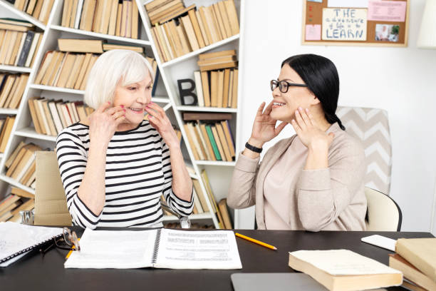 istock Happy senior tutor showing right pronunciation 959247266