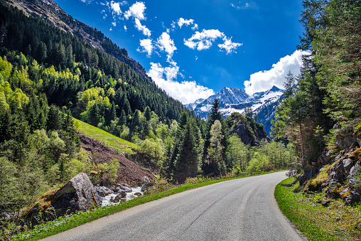 panoramic view of the rocky mountain peaks with winding road