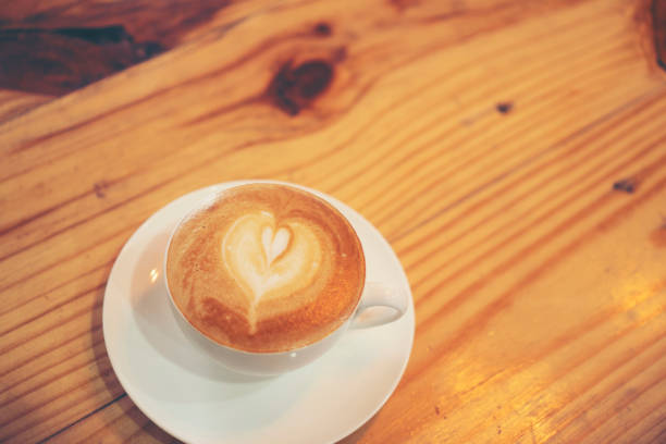 istock Cup of coffee latte in coffee shop 959251388
