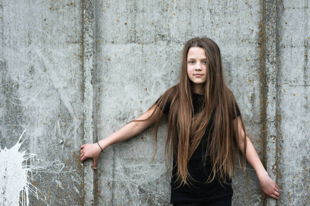 istock child girl near wall 959252008