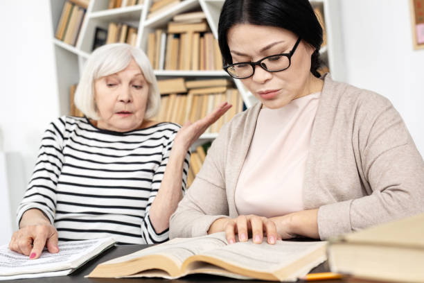 istock Shocked mature tutor overlooking her student 959252912