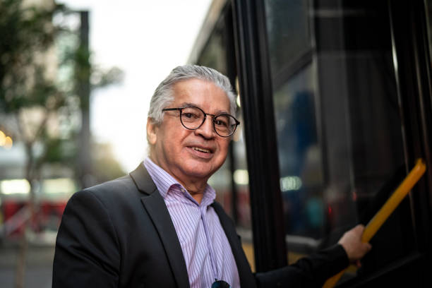 istock Mature Business Man Using Public Transportation - Bus 959262304