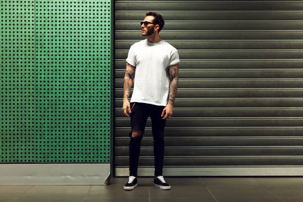 portrait of tattooed young man - white clothing imagens e fotografias de stock