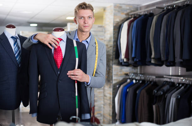 istock Seller in business clothes measuring jacket 959270114
