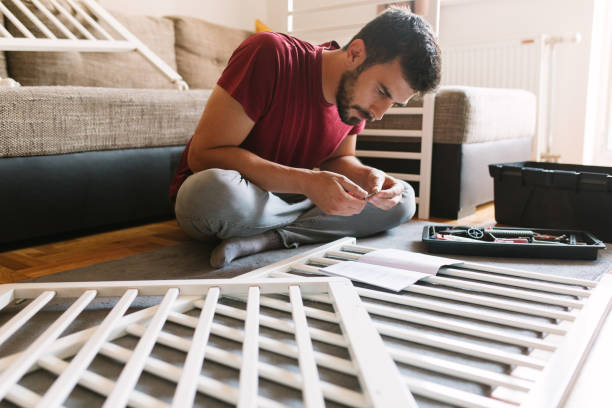 istock Preparing the crib for new family member 959274384