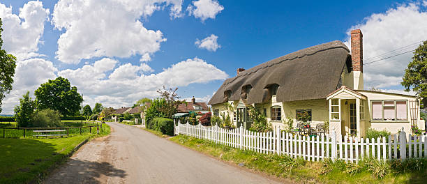 Thatched Cottage, East Creech, West Dorset, England. Quaint and idyllic cottages in well kept landscaped gardens are  feature of the landscape in Dorset with this one in a valley at the base of the Dorset Ridgeway on a coastal footpath between Poole and Weymouth along the Jurassic Coast.