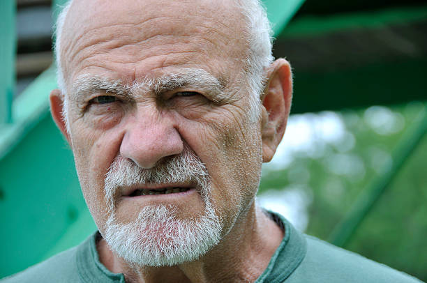 Facial Expression of an Elderly Male stock photo