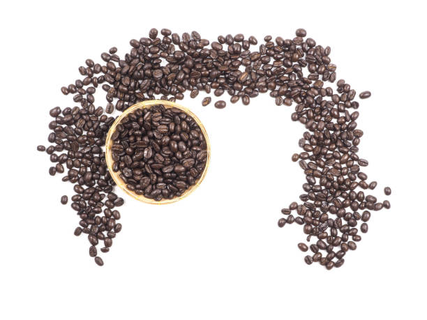 Cup of coffee and coffee beans on wooden spoon on white background
