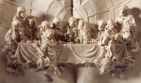The Last Supper sculpture with gold texture and there is light and shadow. 3d render and illustration.