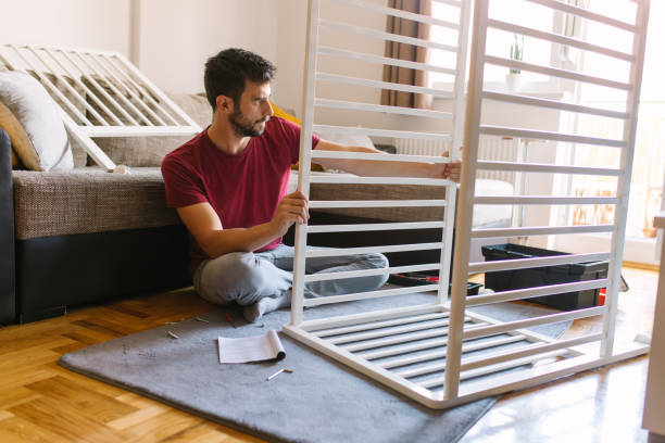 istock Preparing the crib for new family member 959283040