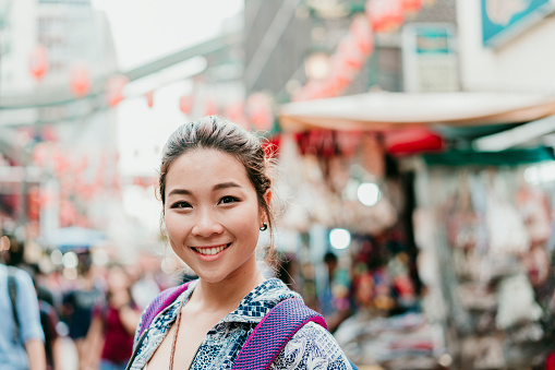 Portrait of a chinese young adult woman in Chinatown