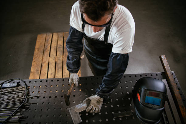 istock Above view of craftsperson working with hammer 959288676