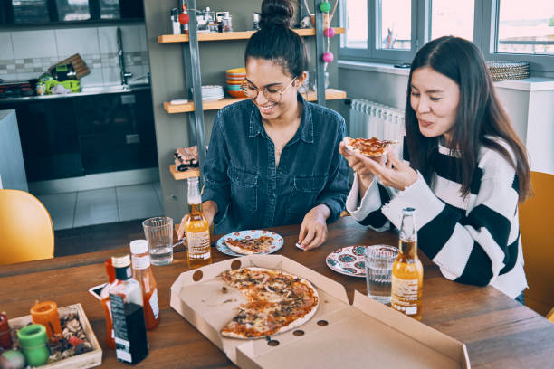 istock friends having lunch at home 959289750