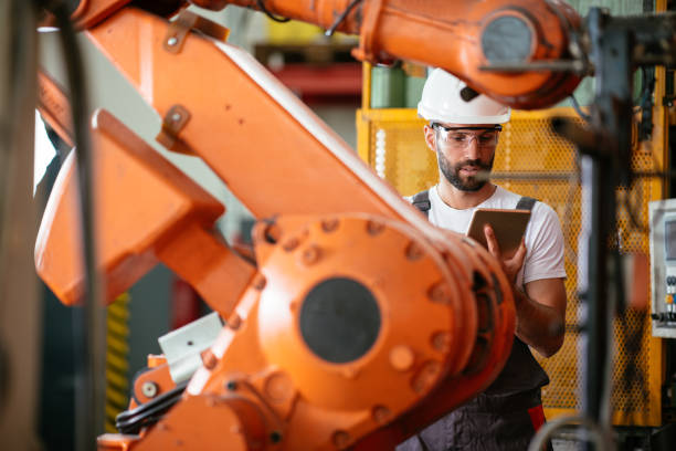 istock Young male engineer working in metal industry 959293376