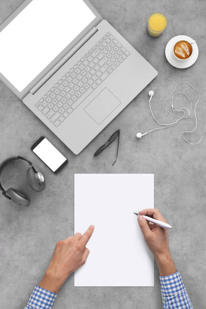 istock Business man writing on a plank paper at an office desk 959295470