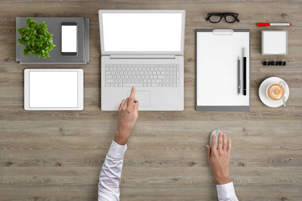 istock Man working on a laptop knolling overhead view 959295510