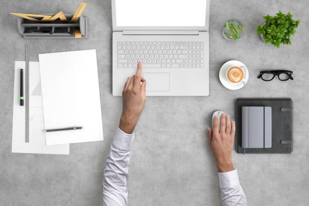 istock Man working on a laptop knolling overhead view 959295526