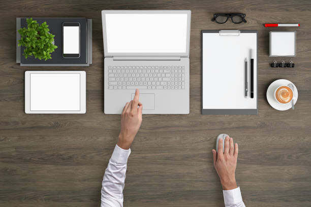 istock Man working on a laptop knolling overhead view 959295556
