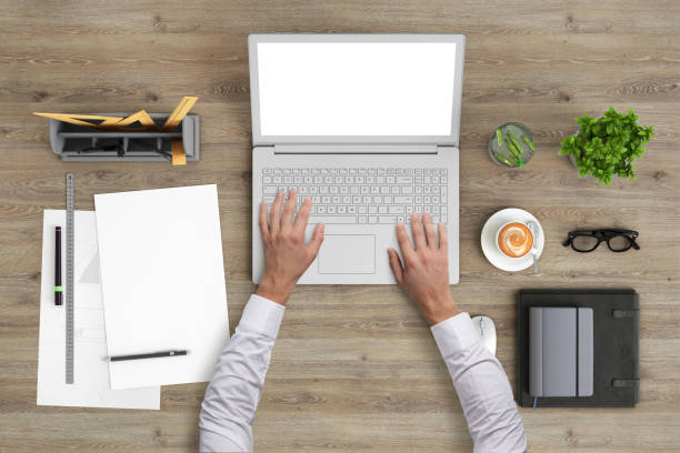 istock Man working on a laptop knolling overhead view 959295568