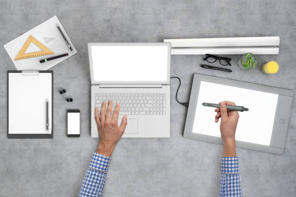 istock Architect designer working on office desk knolling overhead view 959295622