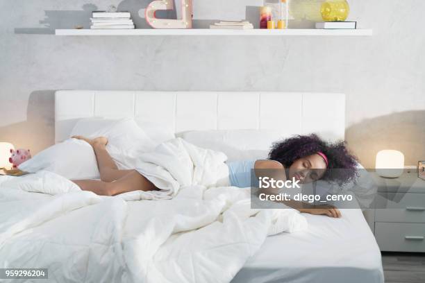 Black Woman Sleeping Alone In Large Bed Stock Photo - Download Image Now - Mattress, Sleeping, Bed - Furniture