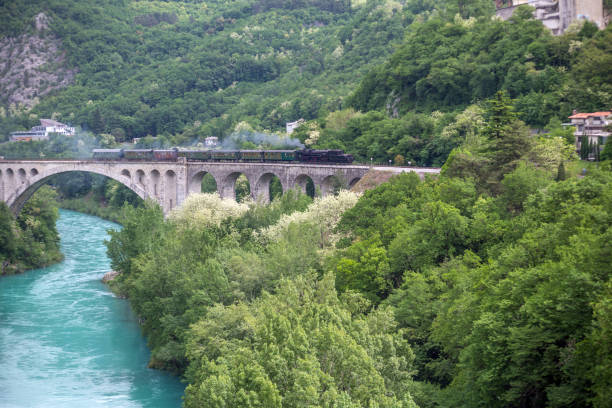 istock Old Steam Train on Bridge over Soca River, Primorska, Slovenia, Europe 959296480