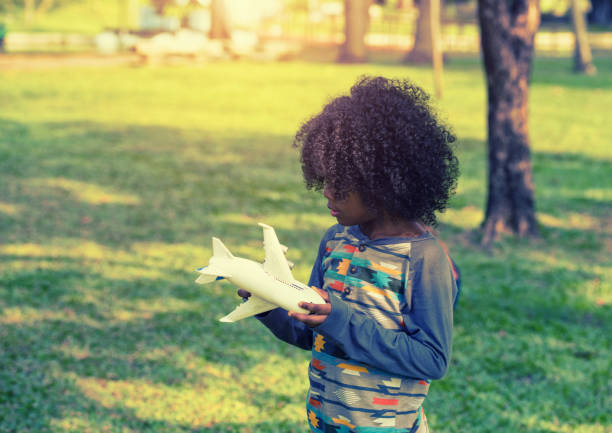 istock The boy is playing the plane. Soft focus concept. 959300186