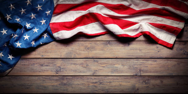 American Flag On Wooden Table - Independence Day - Grunge Textures Aged Usa Flag On Wooden Plank vintage american flag stock pictures, royalty-free photos & images