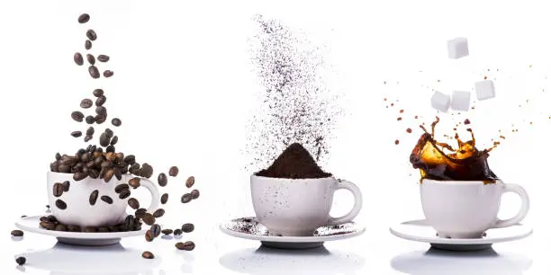 three little cups of different types of coffee:coffee beans,ground  and with liquid coffee.
