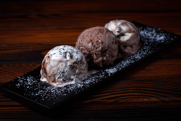 istock chocolate ice cream balls on dark wooden background 959308170