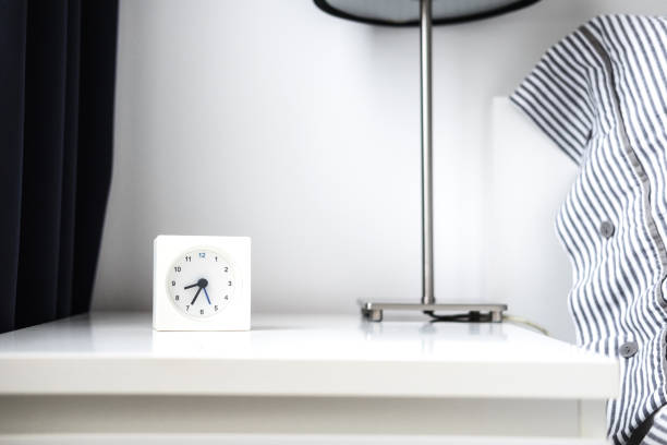 alarm clock in white bedroom iterior - material data sheets imagens e fotografias de stock