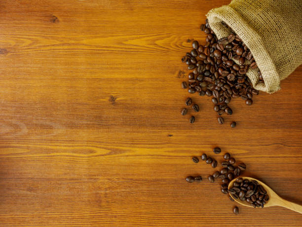 istock Flat lay coffee beans on wooden table 959312172