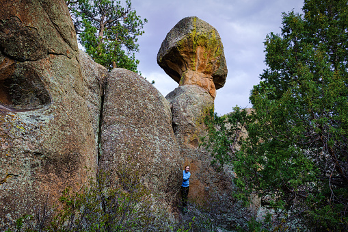Playing in Scenic Canyon - Peek a boo at mushroom shaped rock.