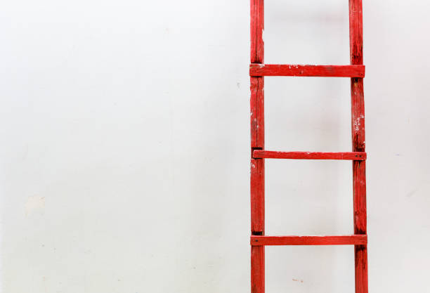 istock Red wooden staircase on a white background. Motivation business concept 959320118
