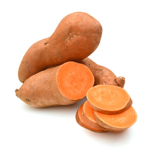 istock Sweet potato with slices isolated on white background 959320666