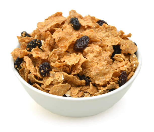 bran and raisin cereal in a bowl , top view bran and raisin cereal in a bowl , top view raisin stock pictures, royalty-free photos & images