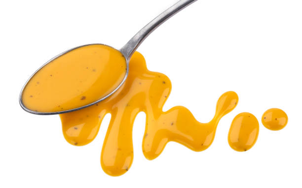 istock Honey mustard sauce with spoon isolated on white background 959324940