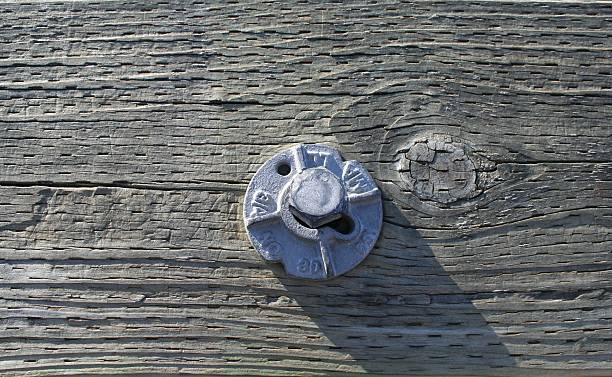 istock Bolt in Wooden Plank 95932638