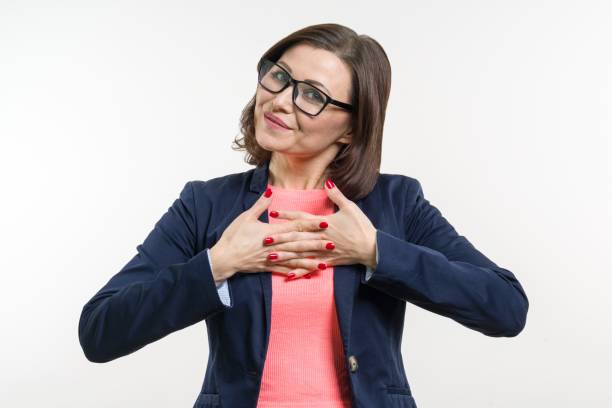 istock Smiling middle aged woman with folded arms on white background 959330528