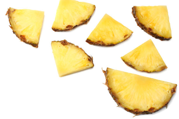 istock healthy background. pineapple slices isolated on white background top view 959332592