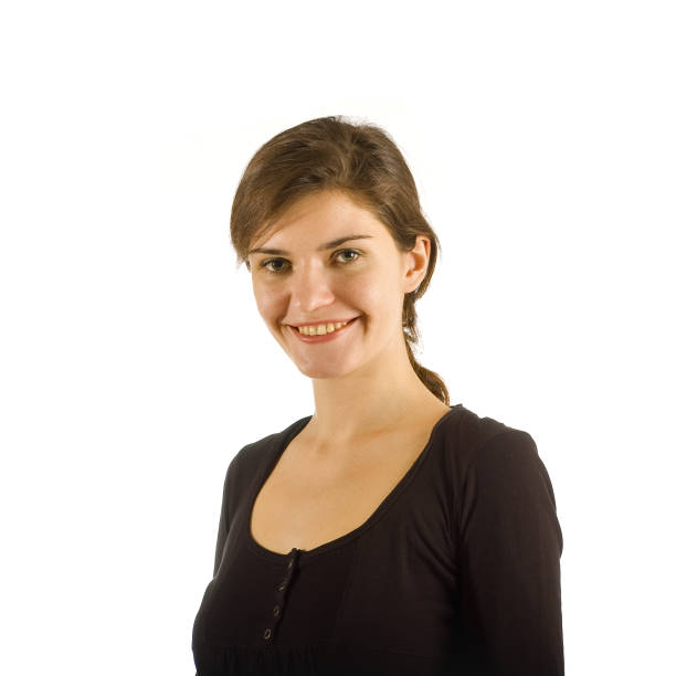 Portrait of a brazilian girl sitting on grass looking at you