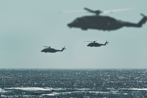 Navy Sikorsky CH-148 Cyclone helicopters over the Atlantic. (Composite)