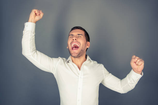 istock A happy man with delightful expression of his face 959341484
