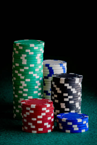 istock casino chips of different colors on green felt table 959341588