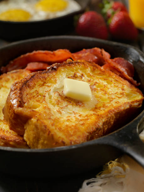 Brioche French Toast with Bacon and Eggs Brioche French Toast with Bacon, Eggs and Fresh Fruit french toast bacon bread butter stock pictures, royalty-free photos & images