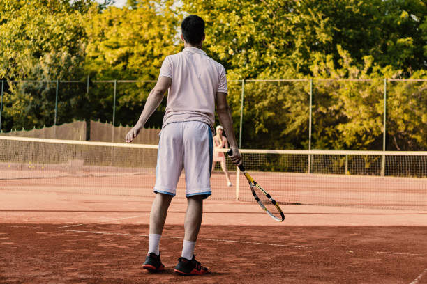 istock Couple playing tennis 959350866