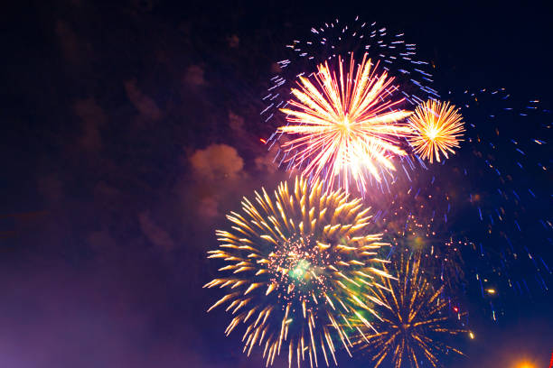 istock Brightly colorful fireworks in the night sky 959353004