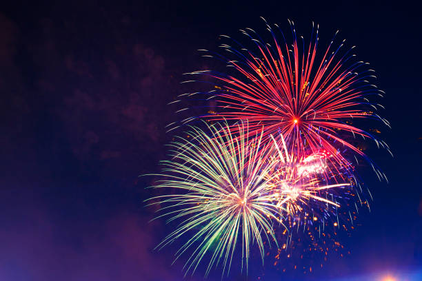 istock Brightly colorful fireworks in the night sky 959353046