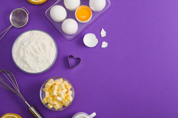 istock Baking flat lay background with eggs floor butter lemon muffins 959353100